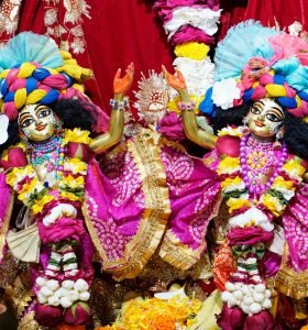 Colorful deities adorned in traditional attire at ISKCON Dhaka Temple, Bangladesh.